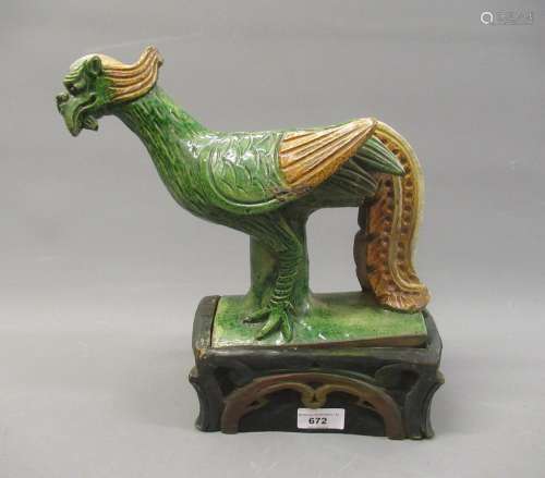 Chinese brown and green glazed pottery roof ridge tile in th...