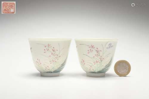 A Group Famille Rose Cups with Flower and Butterfly Patterns...
