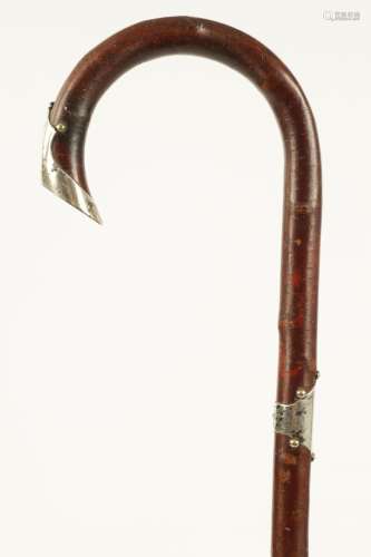 AN EARLY 20TH CENTURY SILVER MOUNTED WALKING STICK