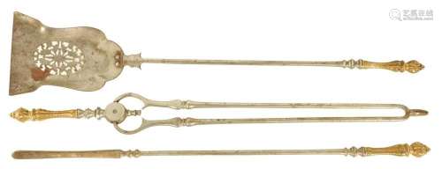 A SET OF GEORGE III GILT BRASS AND STEEL FIRE IRONS