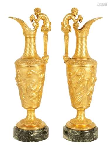 A GOOD PAIR OF 19TH CENTURY FRENCH GILT BRONZE EWERS ON VEIN...