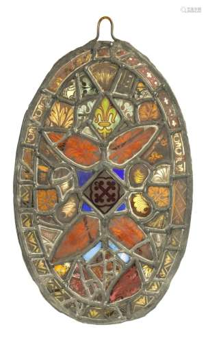 AN 18TH CENTURY STAINED GLASS PANEL WITH FRAGMENTS OF GLASS ...