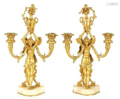 AN ORNATE PAIR OF 19TH CENTURY FRENCH GILT ORMOLU TWO BRANCH...