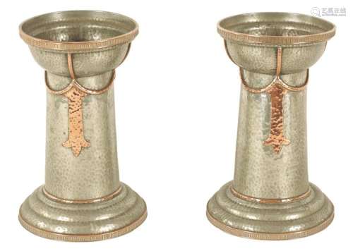 A PAIR OF ARTS AND CRAFTS PEWTER AND COPPER VASES