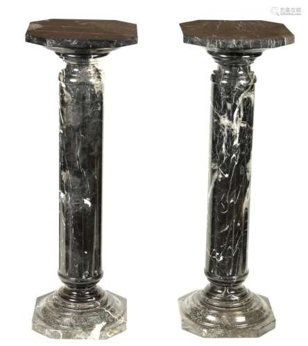 A PAIR OF 19TH CENTURY VEINED BLACK MARBLE REEDED COLUMNS