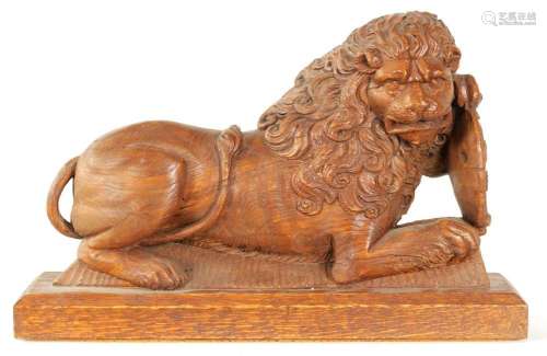 AN 18TH CENTURY CARVED OAK LION