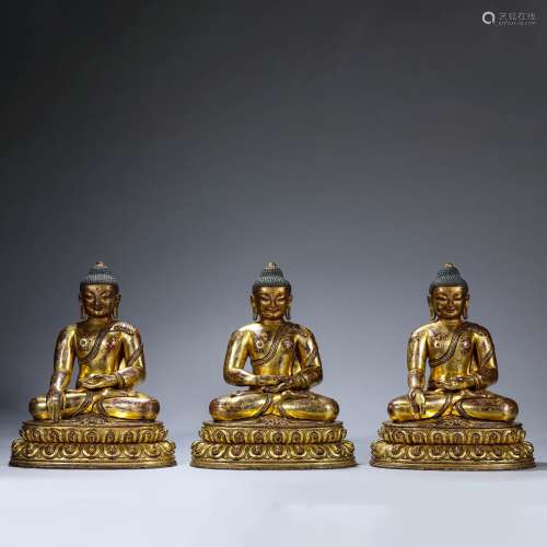 Three Gilt-Bronze Figures of Buddha