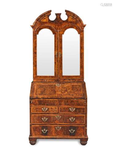 【TP】A George II walnut and featherbanded bureau cabinet