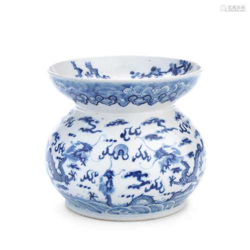 A Chinese blue and white decorated porcelain spitoon or jard...