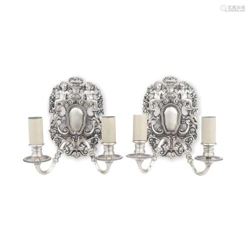 A pair of early 20th century silvered two light wall-sconces...