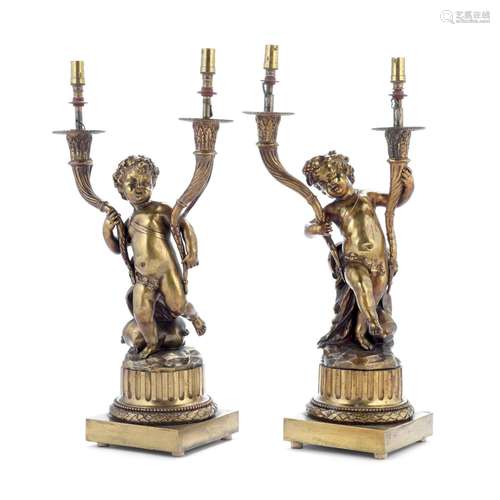 【TP】A pair of late 19th century French gilt bronze twin bran...