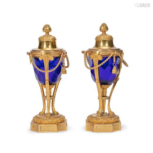 A pair of 19th century French gilt bronze and blue glass cas...