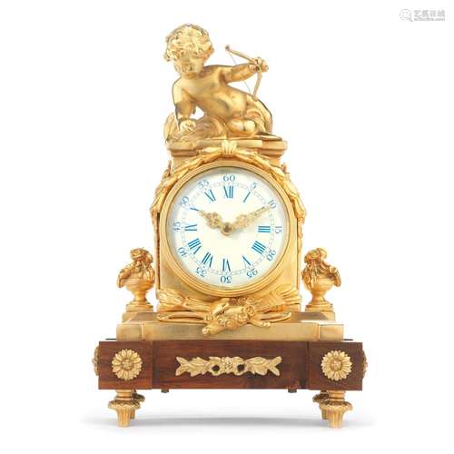 An 20th century gilt brass and mahogany figural timepiece in...