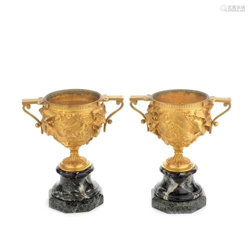 A pair of late 19th century French gilt bronze garniture urn...