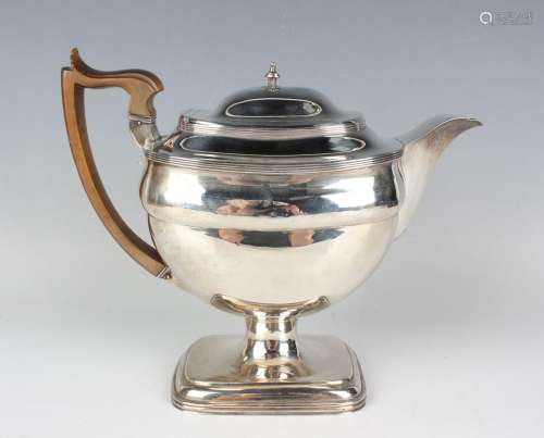 A George III silver cushion shaped teapot with reeded rims, ...