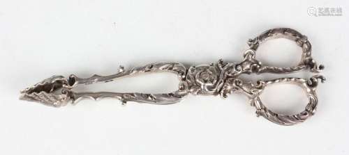 A pair of early Victorian silver sugar tongs with scallop sh...