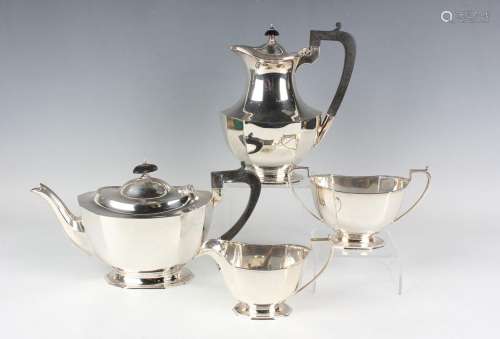 A George V silver four-piece tea set of octagonal faceted ov...