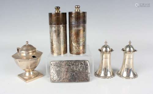 A small group of silver items, comprising a curved rectangul...