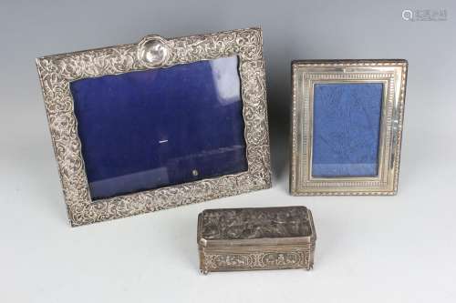 A late Victorian silver mounted rectangular photograph frame...