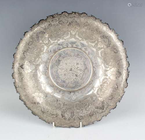 A Persian silver bowl of shallow circular form, the overturn...
