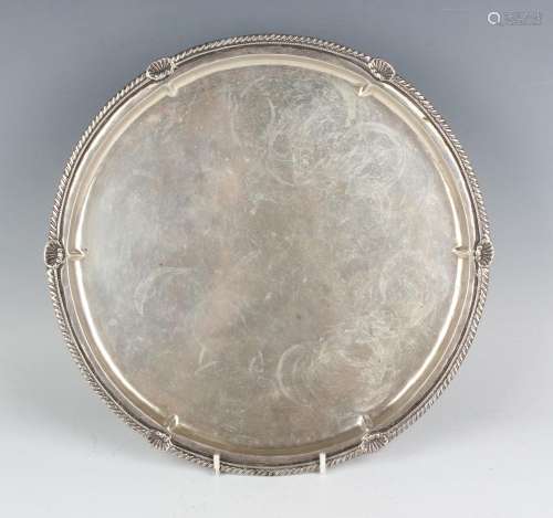 A Turkish .900 silver circular salver with scallop shell and...