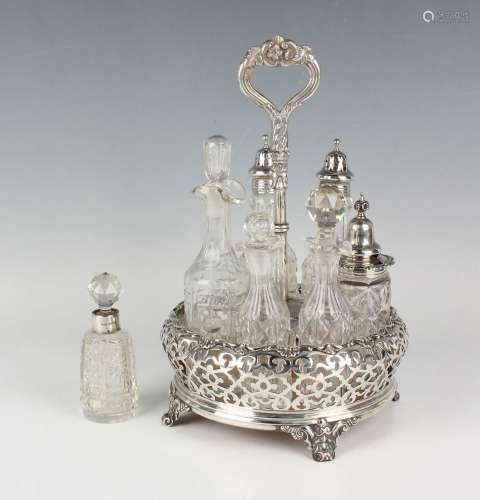 A Victorian silver seven-bottle cruet stand of circular form...