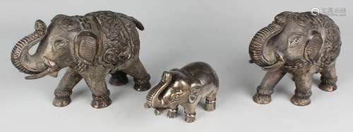 A pair of South-east Asian white metal models of elephants, ...