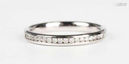 An 18ct white gold and diamond half eternity ring, mounted w...