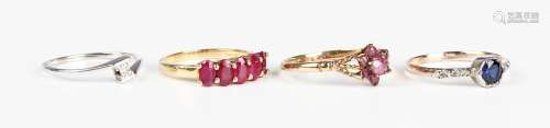 An 18ct gold ring, claw set with a row of five oval cut rubi...