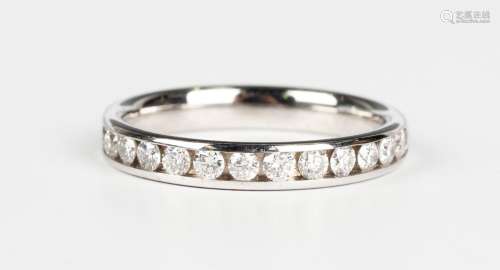 An 18ct white gold and diamond half eternity ring, mounted w...