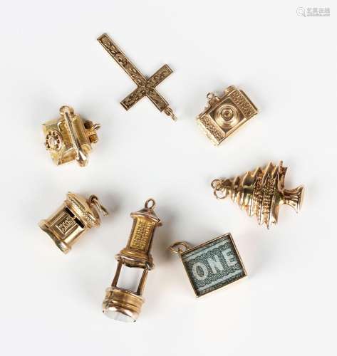 Five 9ct gold charms, comprising telephone, pillar box, one ...