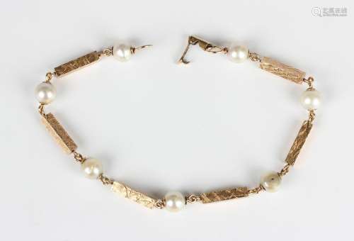 A gold and cultured pearl bracelet in a rectangular baton li...