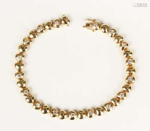 A gold and diamond bracelet in a heart shaped link design, m...