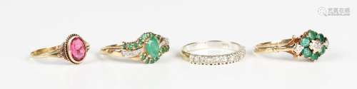 A 9ct gold, emerald and diamond cluster ring, mounted with s...