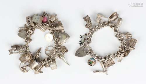 Two silver curblink charm bracelets, each fitted with a vari...