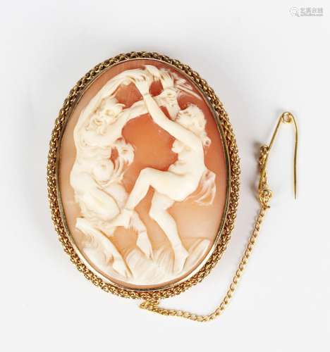 A gold mounted oval shell cameo brooch, carved as a scene of...