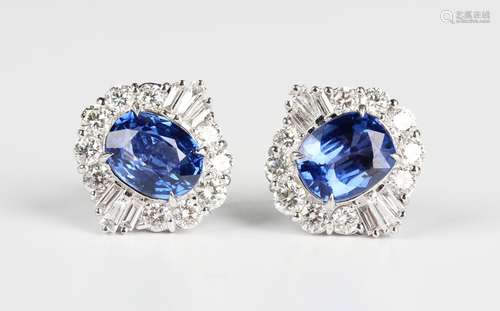 A pair of white gold, sapphire and diamond cluster earstuds,...