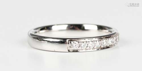 An 18ct white gold and diamond half eternity ring, mounted w...