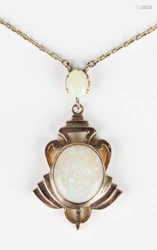 A gold and opal two stone pendant necklace, the principal ov...