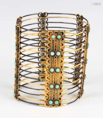 An impressive gold, turquoise and elephant hair wide bangle,...
