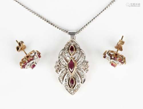 A 9ct gold, ruby and diamond pendant of foliate design, as c...