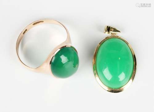 A gold ring, collet set with an oval dyed green chalcedony, ...