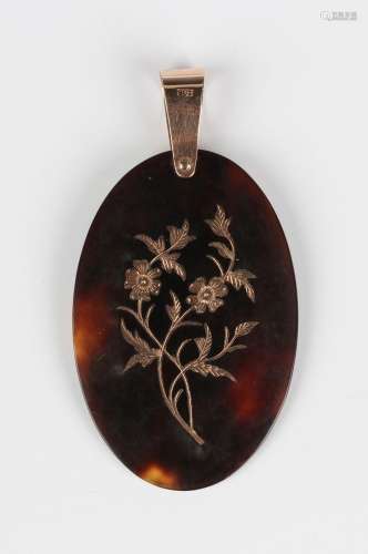 A gold mounted tortoiseshell oval pendant, piqué inlaid with...
