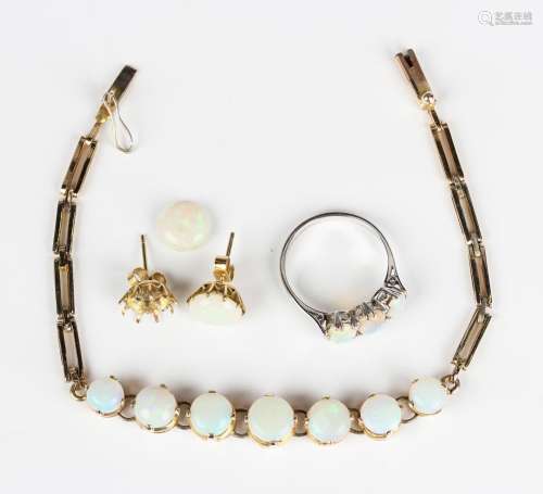 A group of opal set jewellery, comprising a gilt metal brace...