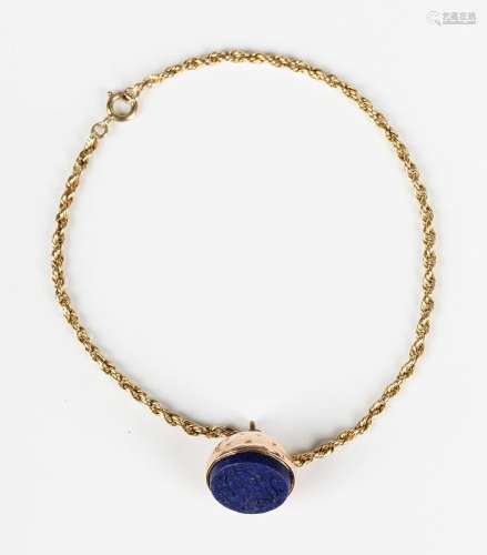 A gold and lapis lazuli intaglio pendant, unmarked, length 1...