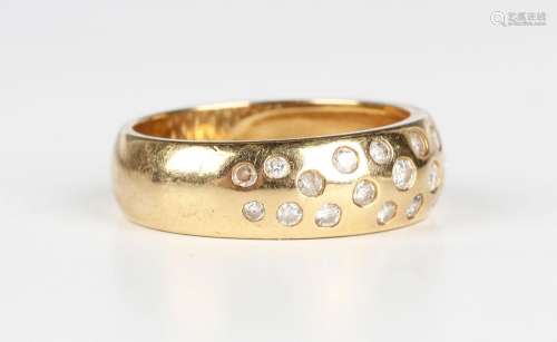 An 18ct gold and diamond ring, mounted with circular cut dia...
