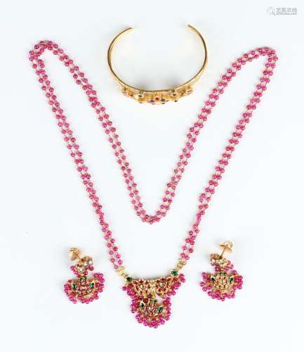 A gold, varicoloured paste and red glass bead suite of jewel...