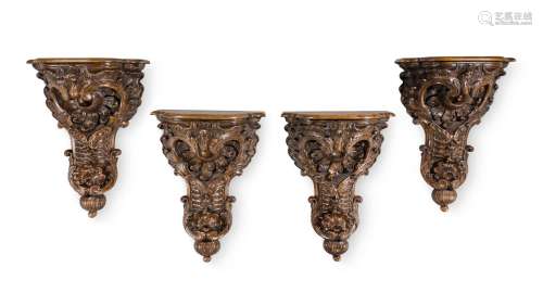 A SET OF FOUR LARGE CARVED WALNUT WALL BRACKETS, IN 18TH CEN...