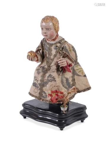 A SPANISH COLONIAL CARVED POLYCHROME FIGURE OF THE SEATED CH...