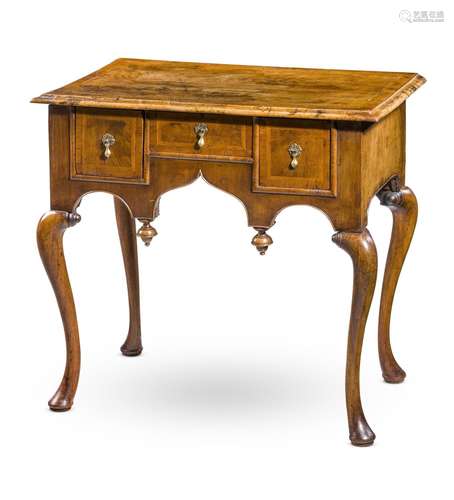 A GEORGE I WALNUT AND FEATHER BANDED SIDE TABLE, CIRCA 1720